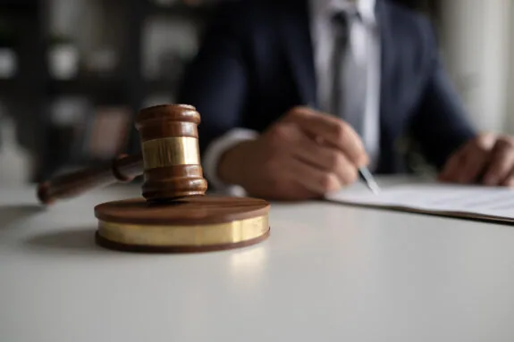 Legal advisor lawyer examining and signing legal documents